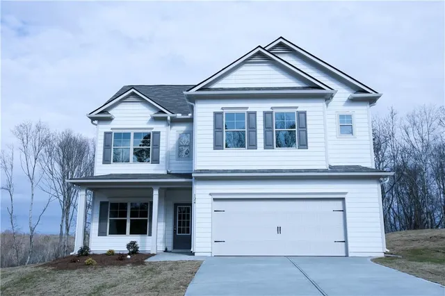 a view of a house with large windows