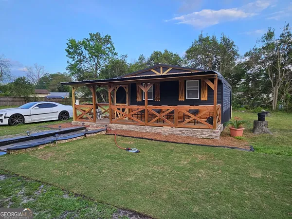 a front view of a house with patio