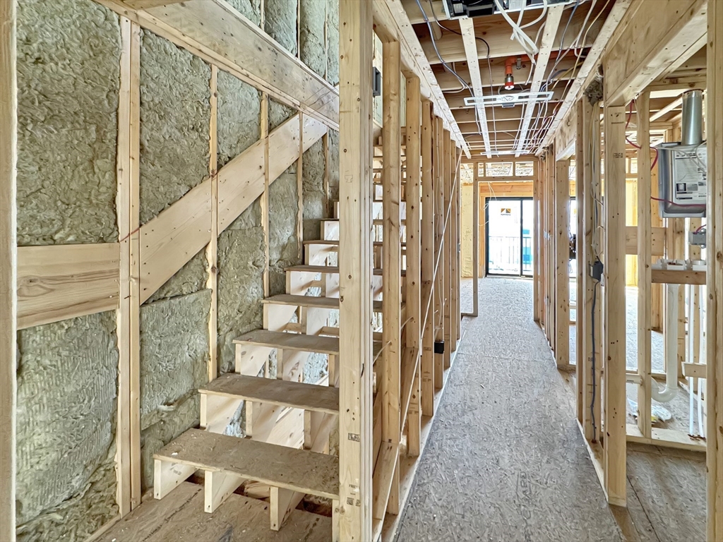 16 North End Boulevard, Unit 5 Salisbury, MA 01952 - Photo 7 of 14 a view of entryway with wooden floor and windows