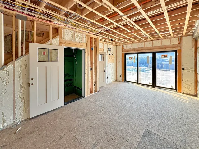 a view of a patio with wooden floor