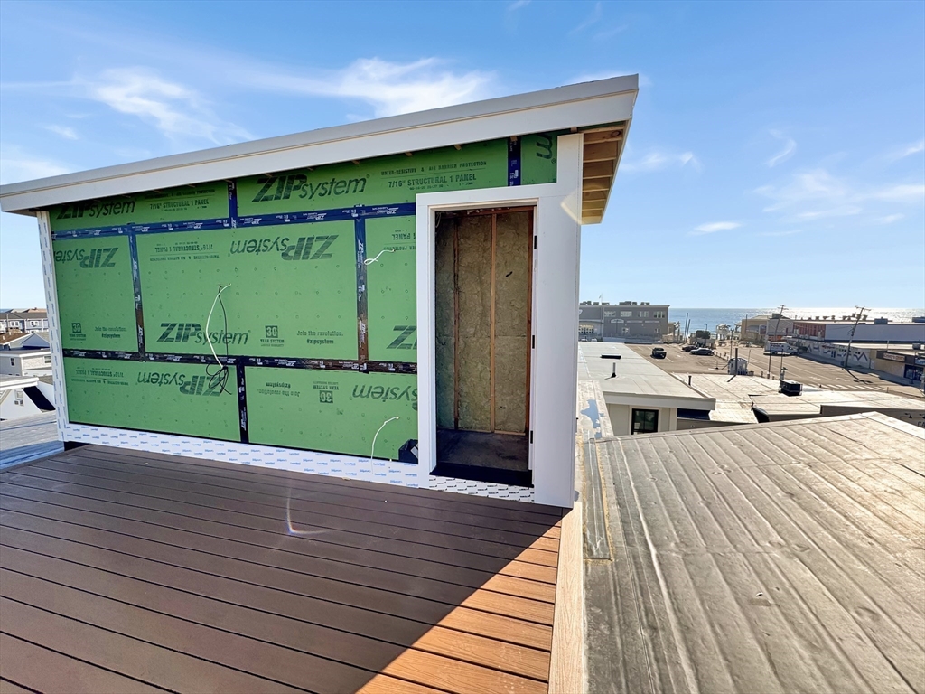 16 North End Boulevard, Unit 5 Salisbury, MA 01952 - Photo 10 of 14 a view of a patio with wooden floor