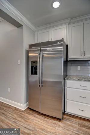 a view of cabinets and wooden floor