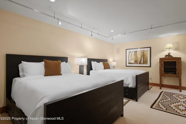 a bedroom with double bed and a night stand