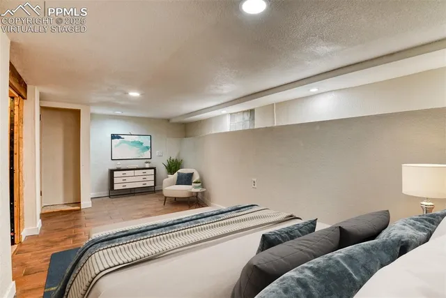 a bedroom with a bed and a couch