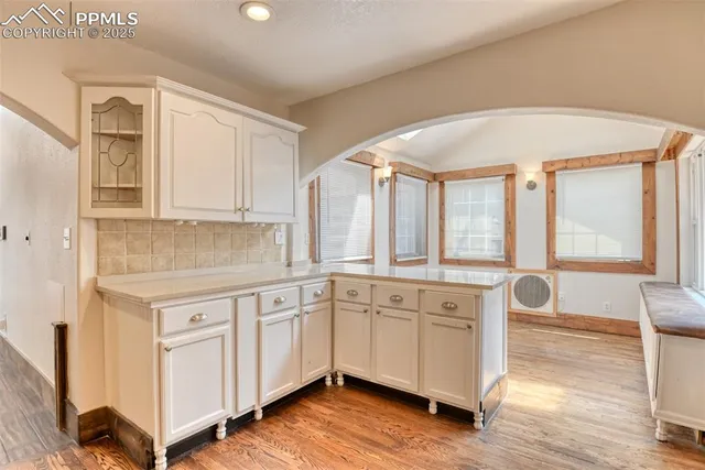 a spacious bathroom with a granite countertop sink and a mirror