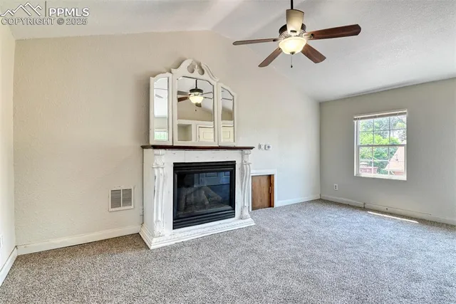 a view of a room with wooden walls