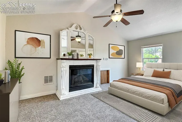 a bedroom with a bed and a fireplace