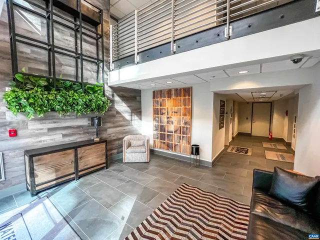 a lobby with furniture and window