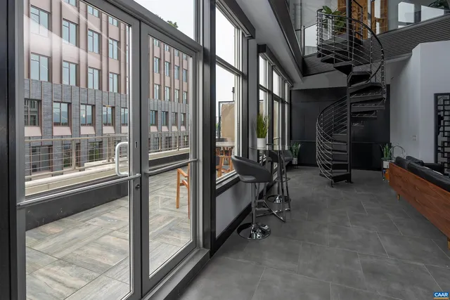 a view of an empty room with a staircase