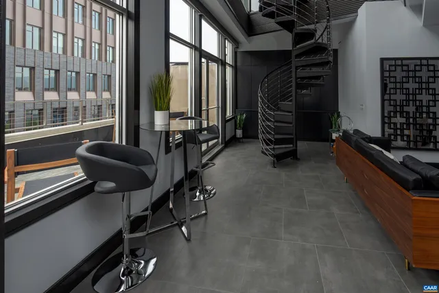 a room with gym equipment and a large window