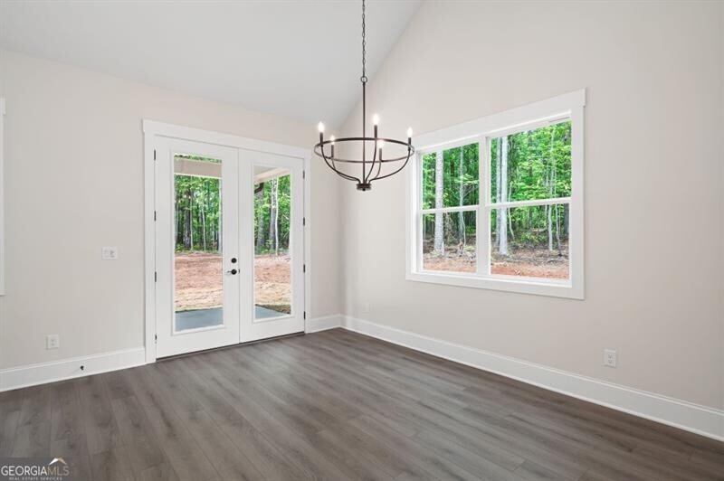 110 Doris Path Dallas, GA 30157 - Photo 13 of 35 a view of an empty room with wooden floor and a window