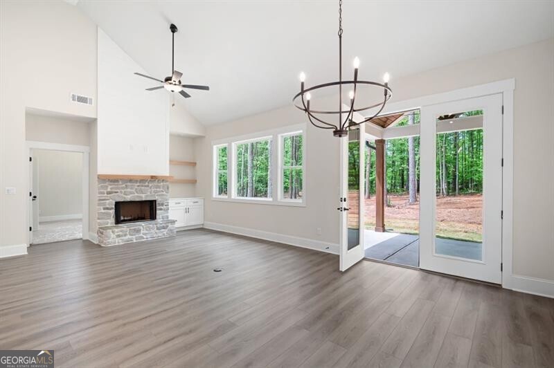 110 Doris Path Dallas, GA 30157 - Photo 14 of 35 a view of an empty room with wooden floor fireplace and a window