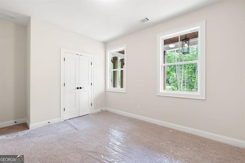 110 Doris Path Dallas, GA 30157 - Photo 25 of 35 an empty room with windows