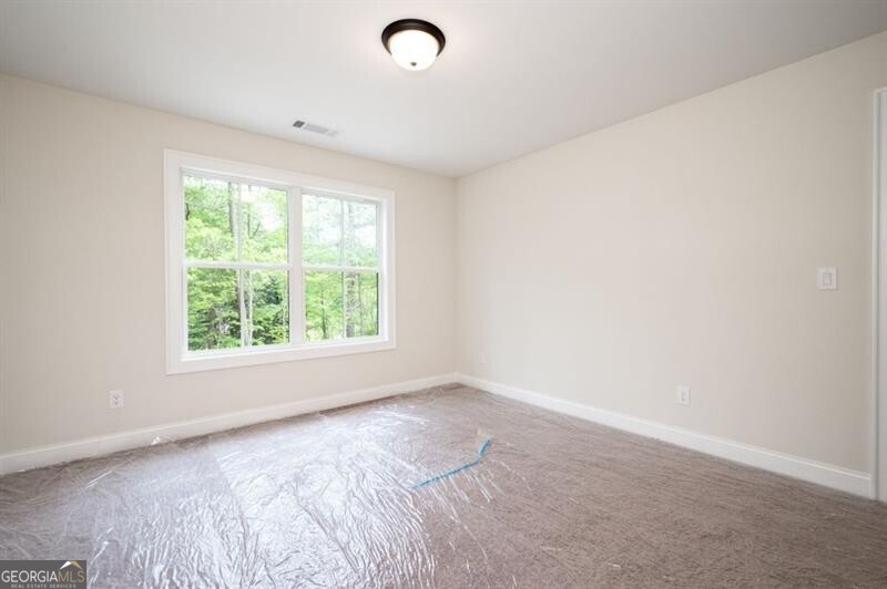 110 Doris Path Dallas, GA 30157 - Photo 27 of 35 an empty room with a window