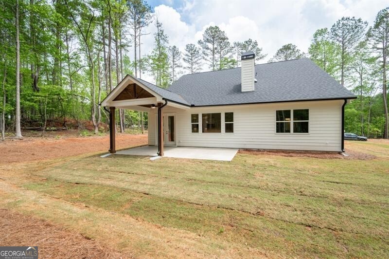 110 Doris Path Dallas, GA 30157 - Photo 31 of 35 a front view of a house with a garden