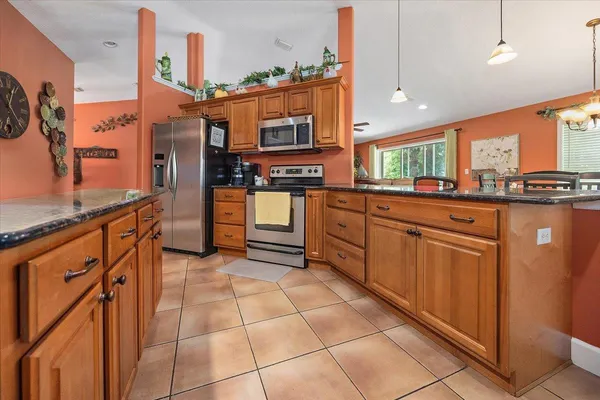 a kitchen with stainless steel appliances a sink and counter space