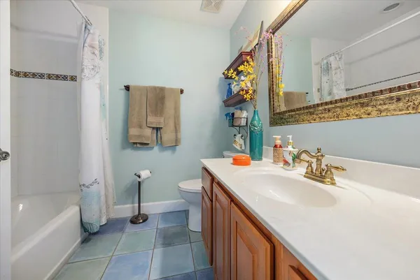 a bathroom with a sink a toilet and a bathtub