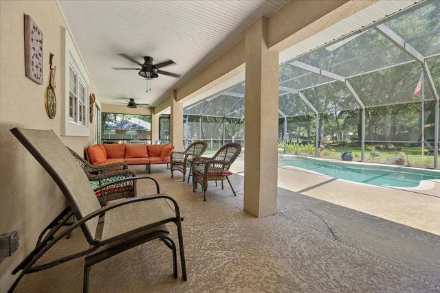 a view of a livingroom with furniture and a porch