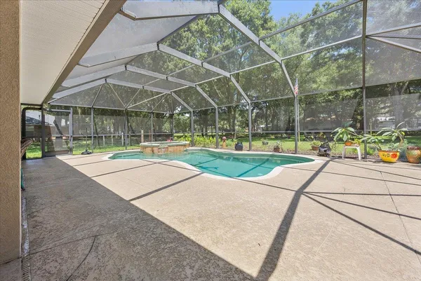 a view of a swimming pool with a patio