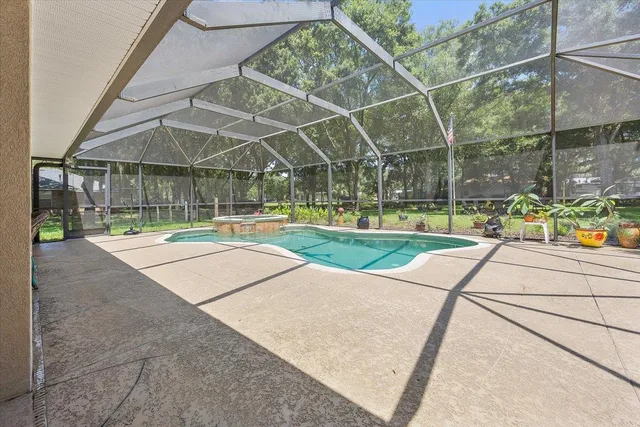 a view of a swimming pool with a patio