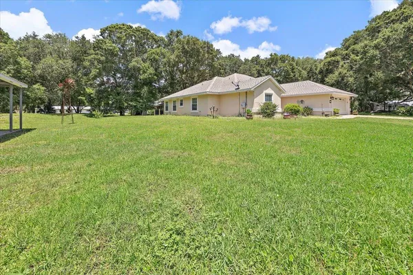 a front view of a house with a yard and porch