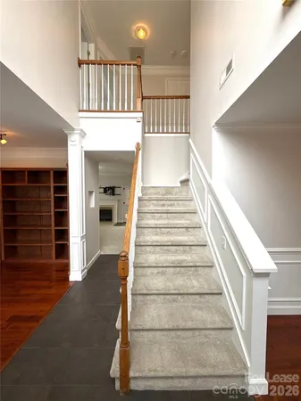 a view of entryway and hall with wooden floor