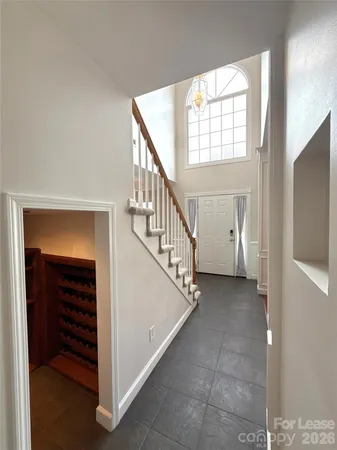 a view of entryway and hall with a front door