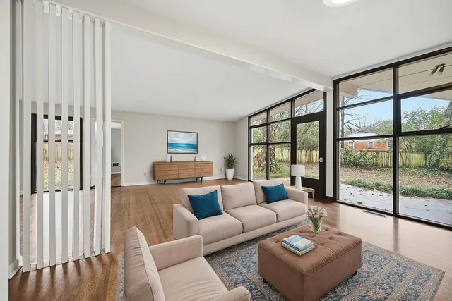 a living room with furniture and a large window
