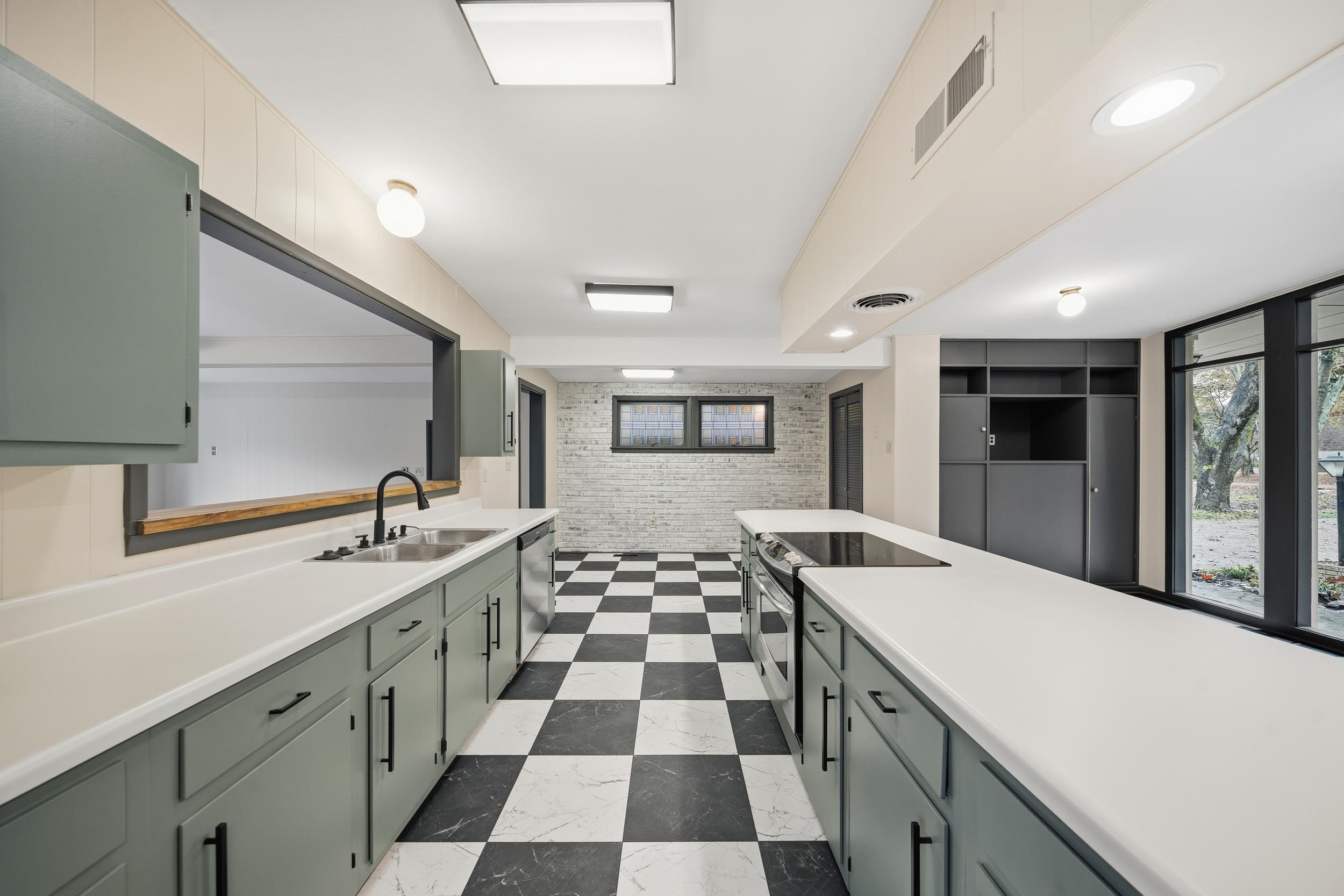 2534 Elmore Park Road Bartlett, TN 38134 - Photo 11 of 35 a kitchen with a sink and a white refrigerator