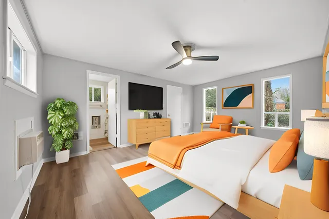 a view of an empty room with wooden and a window