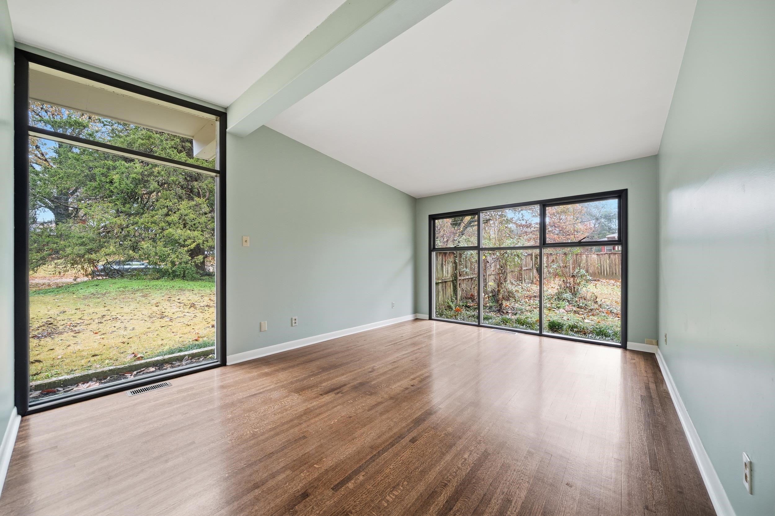 2534 Elmore Park Road Bartlett, TN 38134 - Photo 21 of 35 wooden floor in an empty room with a window