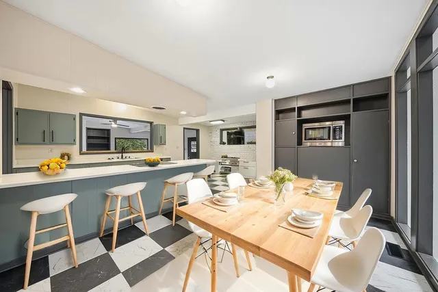 a view of an empty room with a black and white checkered floor