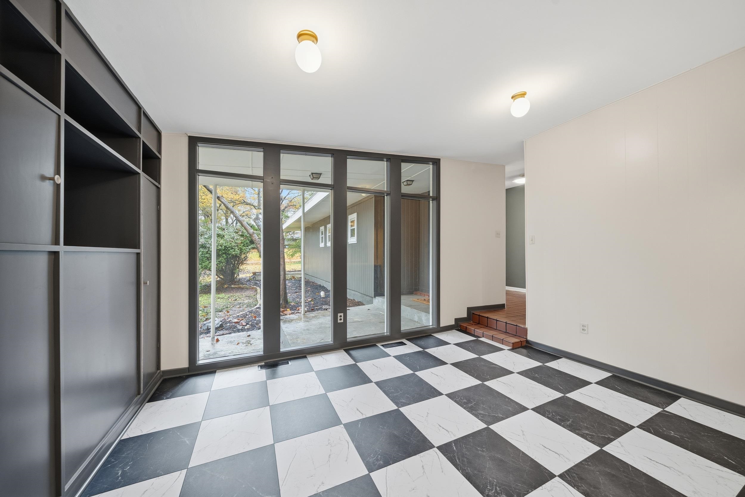 2534 Elmore Park Road Bartlett, TN 38134 - Photo 9 of 35 a view of an empty room with a black and white checkered floor