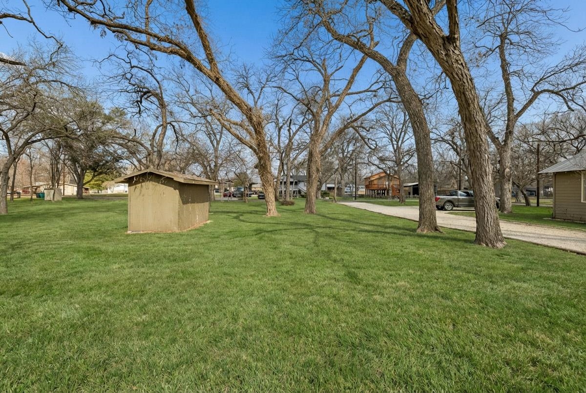 1307 Terminal Loop Road McQueeney, TX 78123 - Photo 18 of 23 a big yard with lots of green space and trees