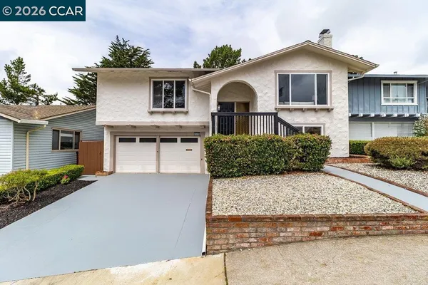 a front view of a house with garage