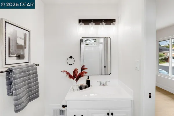 a view of a bathroom with tub and shower