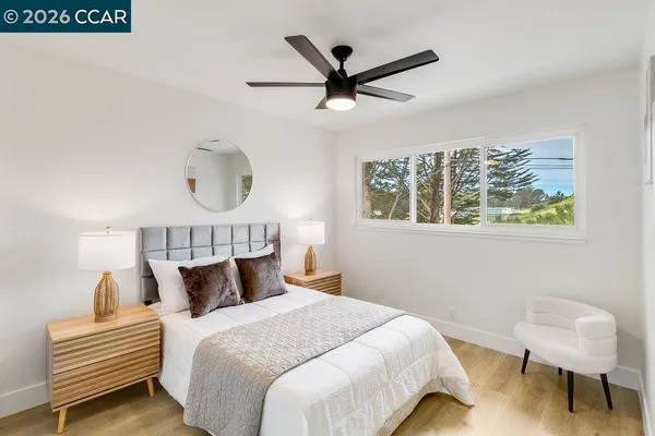 a bedroom with a bed and a book shelf