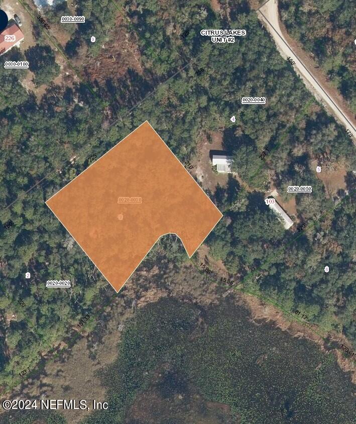 124 Pleasant Trail Crescent City, FL 32112 - Photo 2 of 11 a view of a tree with a yard