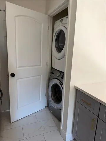 a view of a hallway with washer and dryer