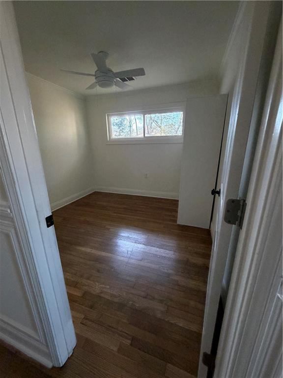 2484 Ortega Way Atlanta, GA 30341 - Photo 13 of 28 a view of an empty room with wooden floor and a window