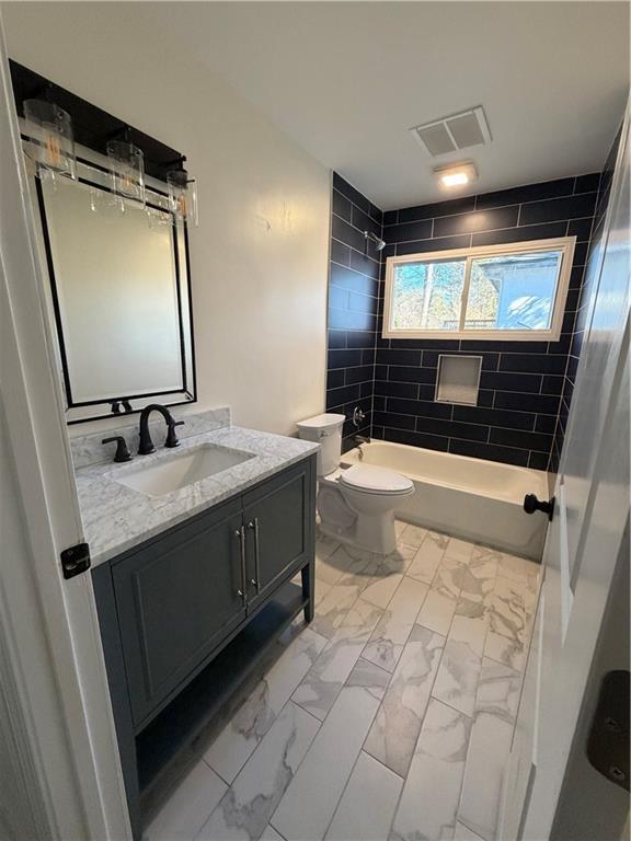 2484 Ortega Way Atlanta, GA 30341 - Photo 15 of 28 a bathroom with a sink a vanity and mirror