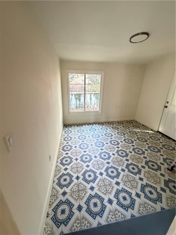 2484 Ortega Way Atlanta, GA 30341 - Photo 10 of 28 a view of an empty room and window