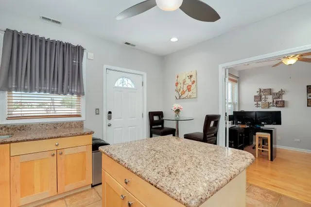 a livingroom with workspace and a window