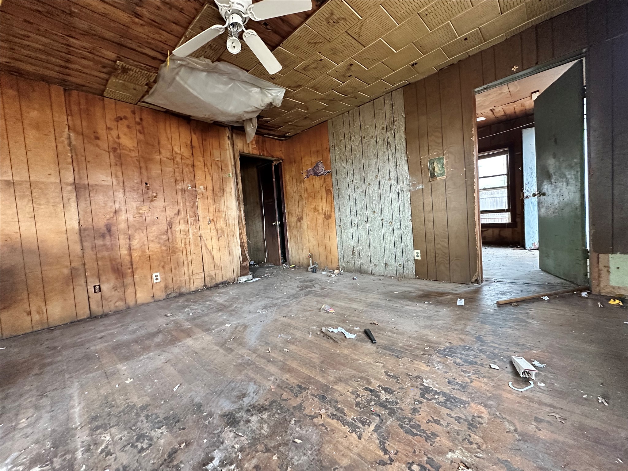 408 West Allen Street Kyle, TX 78640 - Photo 5 of 20 Spare room with wooden walls, a ceiling fan, and wooden ceiling