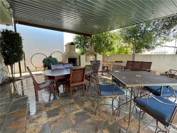 a outdoor dining space with furniture and outdoor view