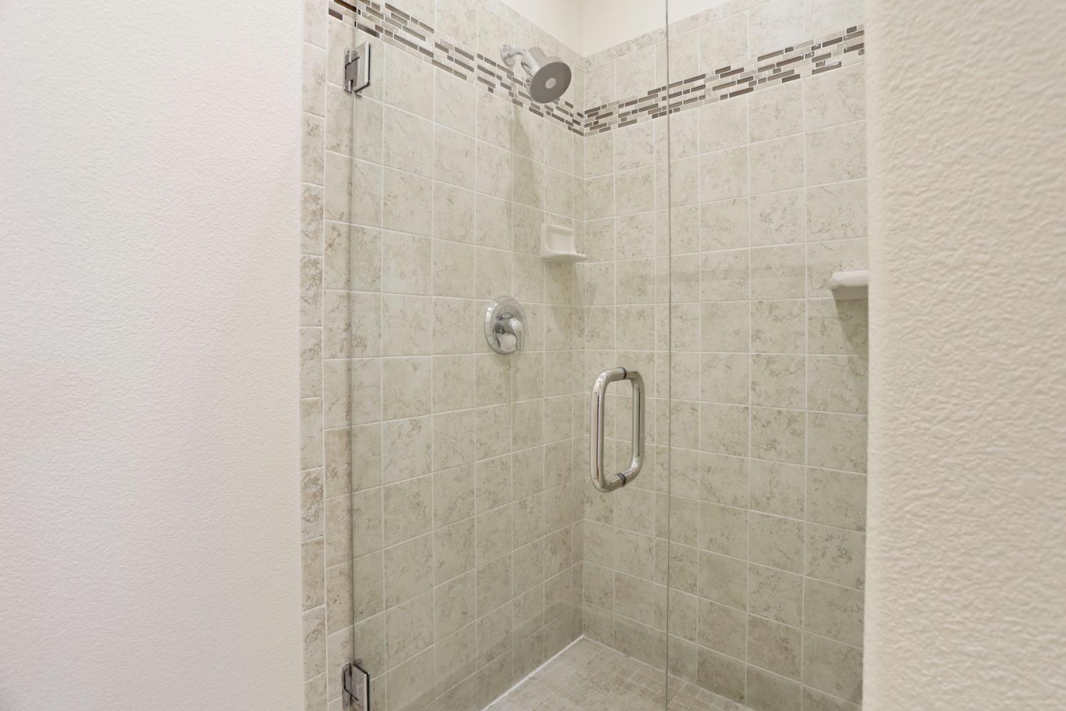 312 Copper Crest Drive Copperopolis, CA 95228 - Photo 14 of 38 a bathroom with a shower