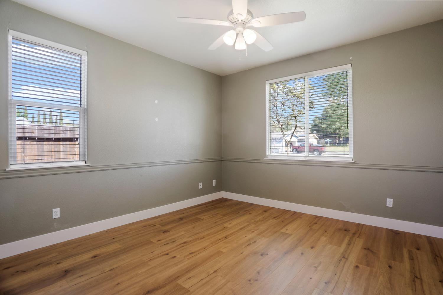 312 Copper Crest Drive Copperopolis, CA 95228 - Photo 18 of 38 a view of wooden floor and windows in a room