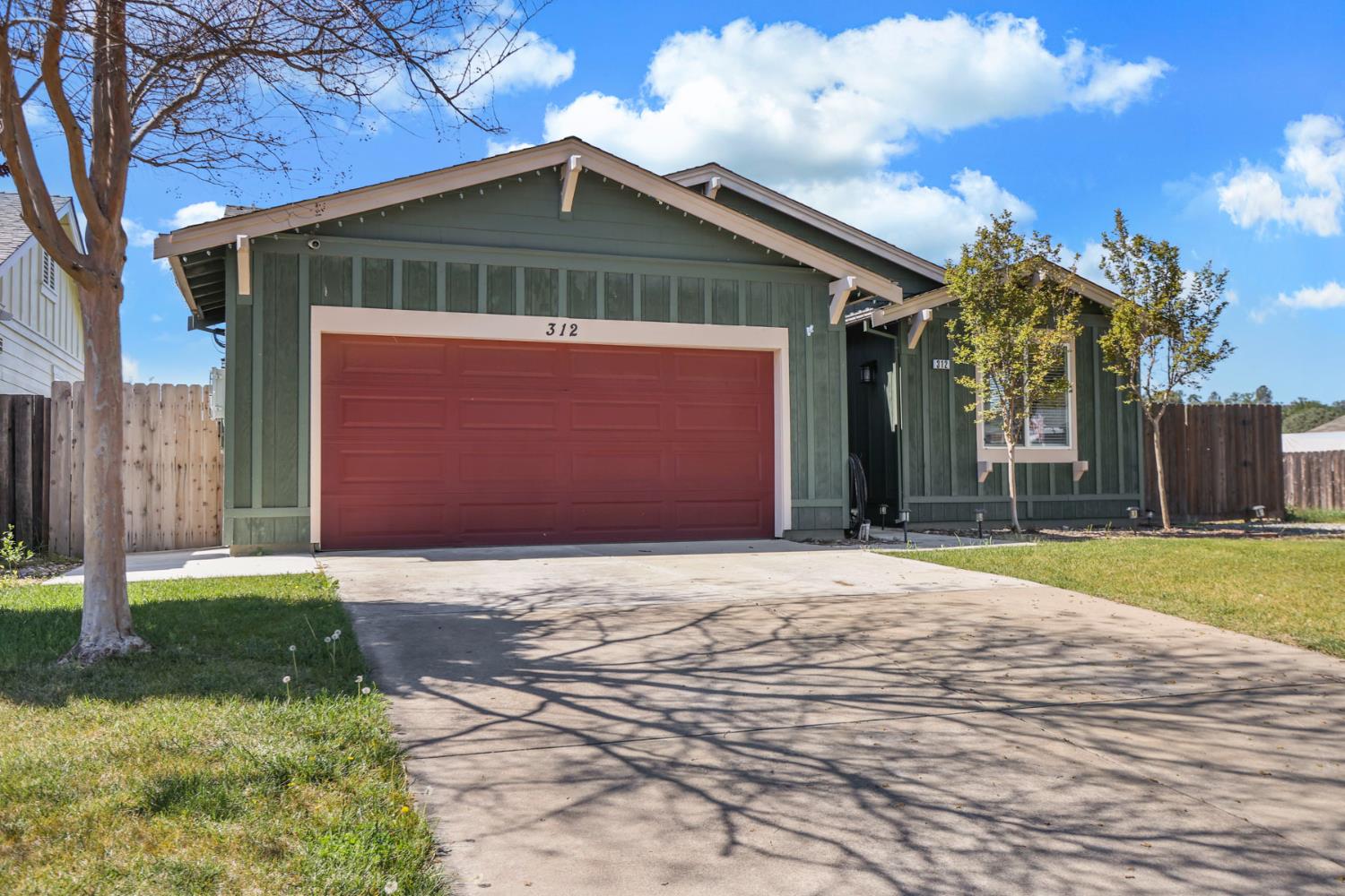 312 Copper Crest Drive Copperopolis, CA 95228 - Photo 2 of 38 a front view of a house with a yard