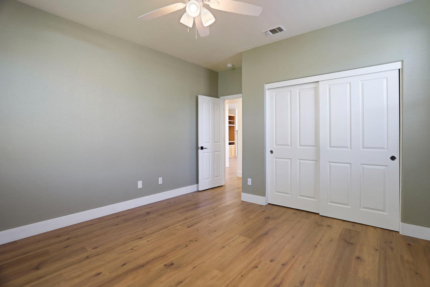 312 Copper Crest Drive Copperopolis, CA 95228 - Photo 28 of 38 a view of an empty room with wooden floor