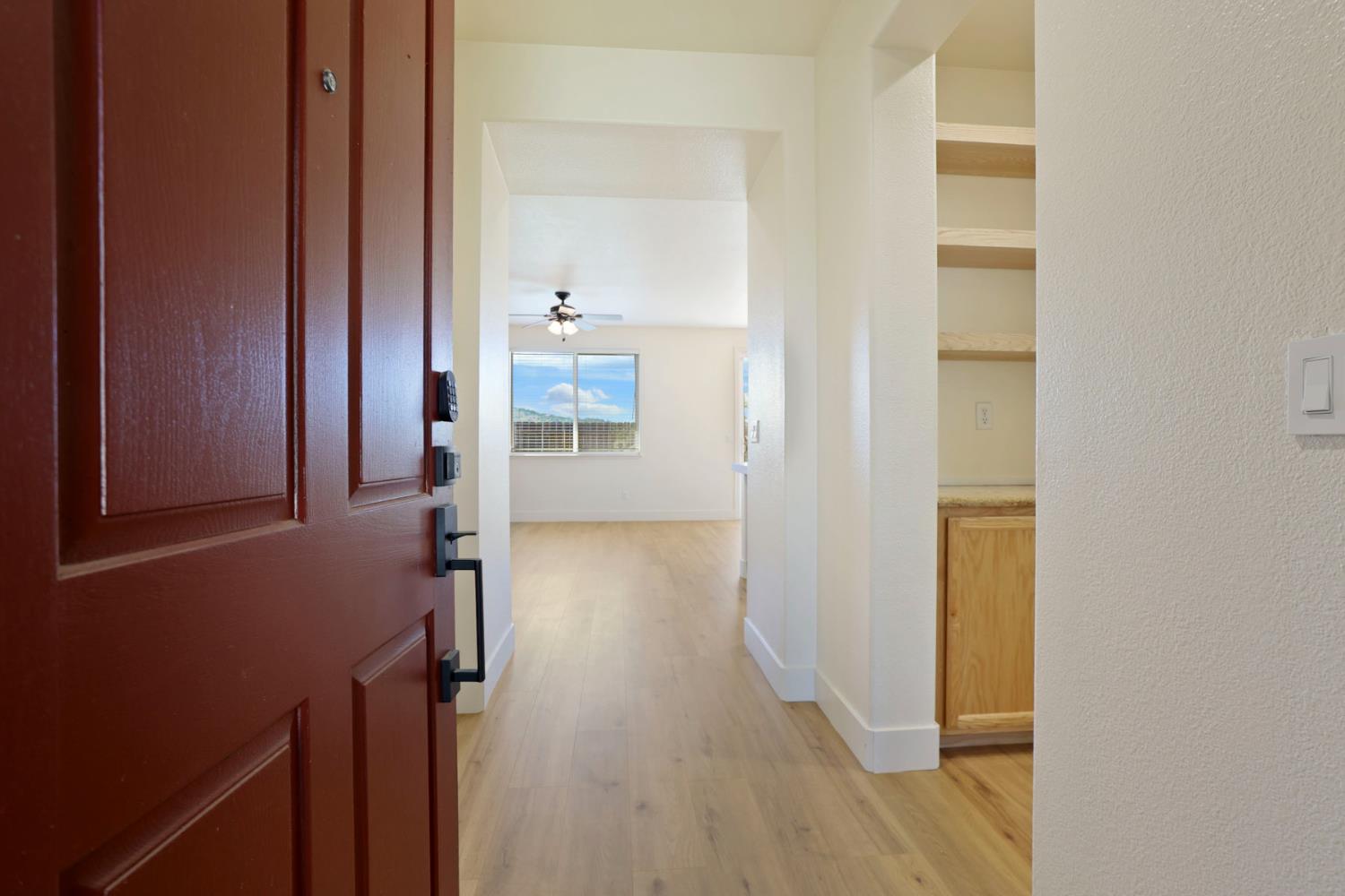 312 Copper Crest Drive Copperopolis, CA 95228 - Photo 3 of 38 a view of a hallway with wooden floor